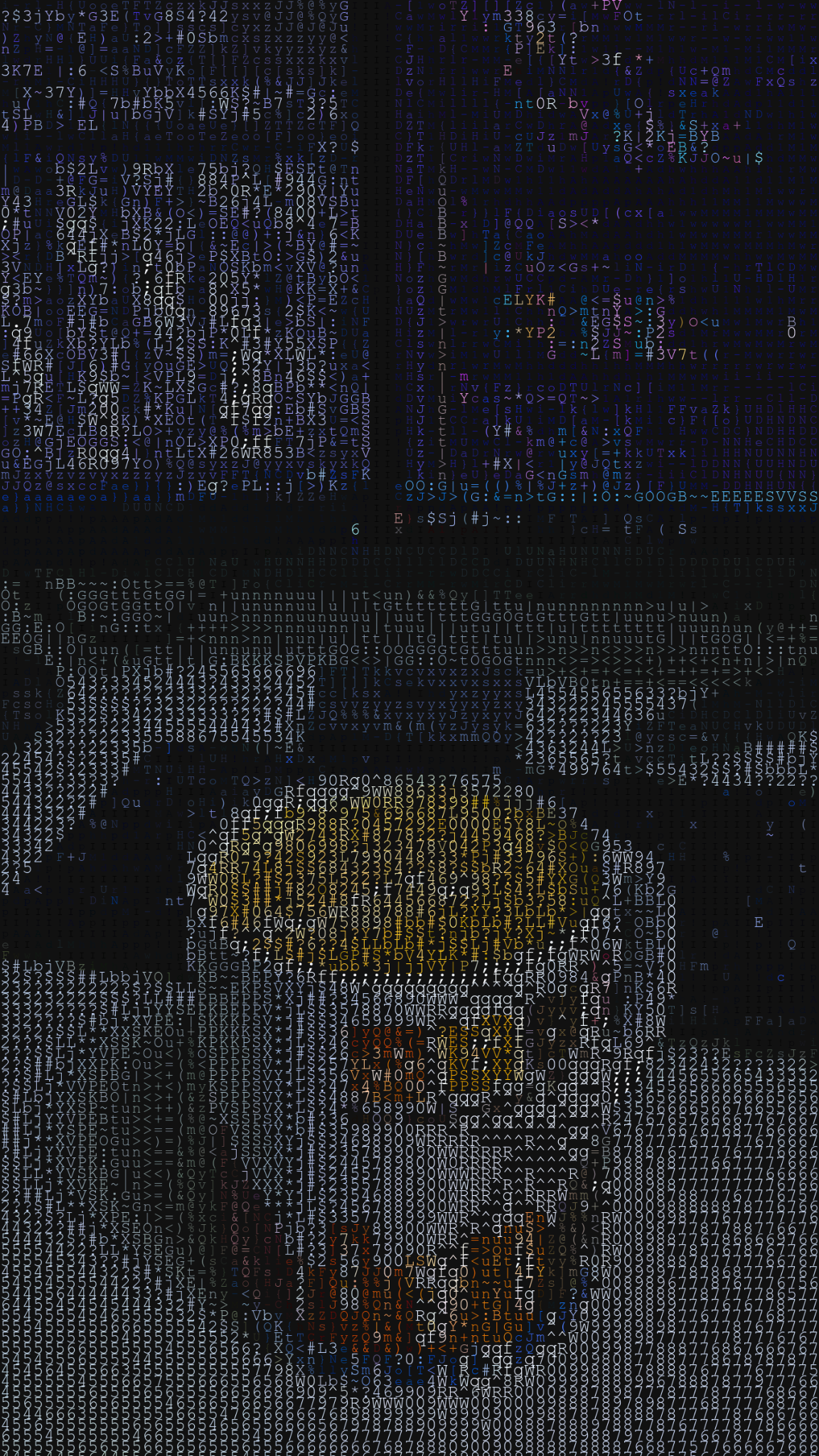 coding with a cup of coffee on a table in front of a dual screen setup with keyboard